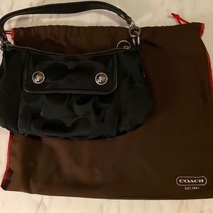 Black Coach Handbag. In original sleeve.